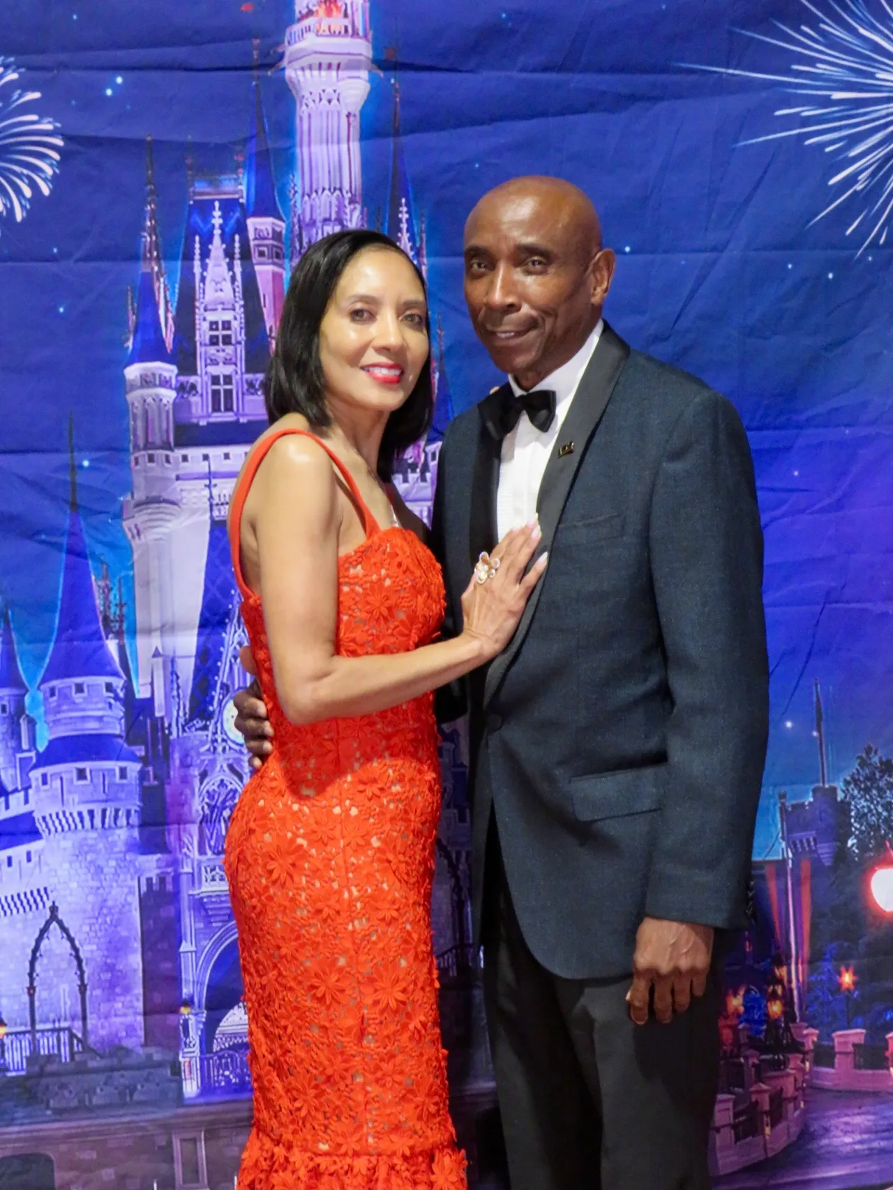 Smiling pair with castle background