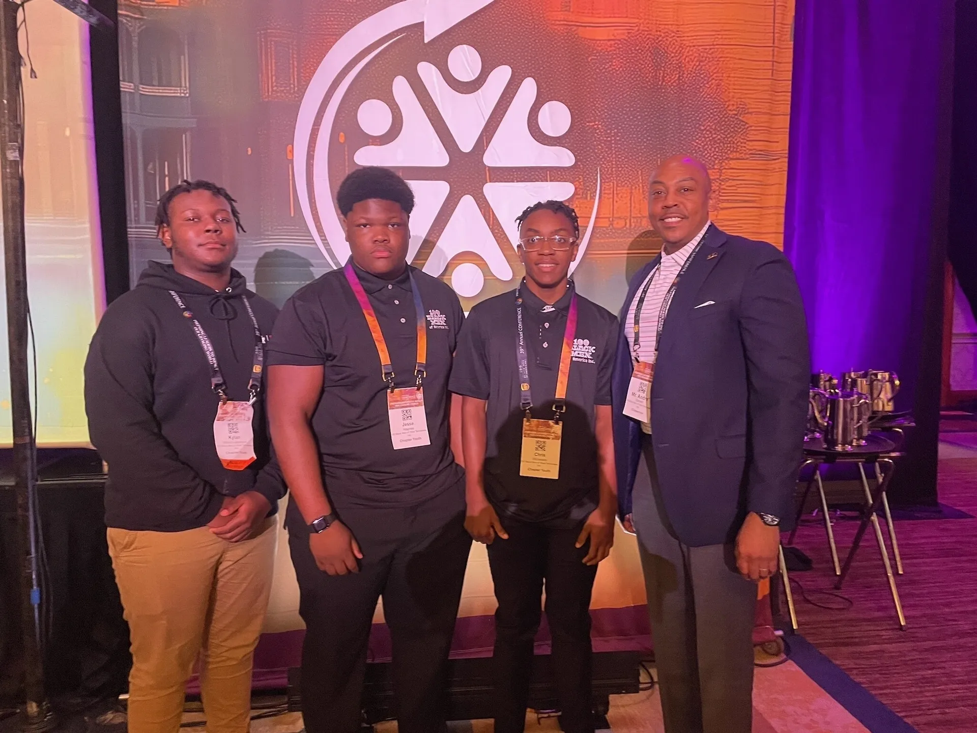 Conference attendees smiling in a group photo