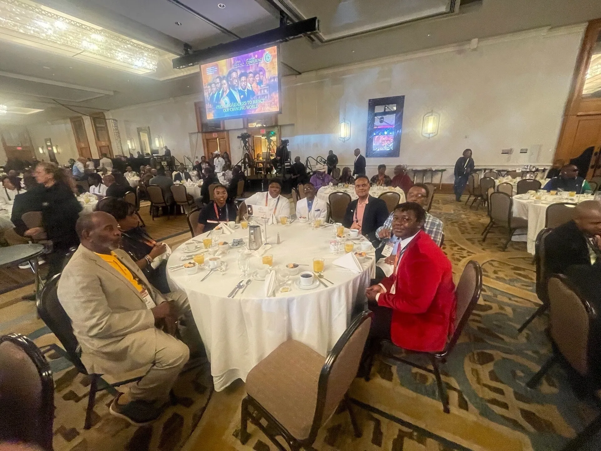 People seated at a banquet table